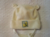 Dětská čepička zavazovací s oušky.
Velikost: 0, 6-9 měsíců. 
Složení materiálu: 100% Polyester.
Barevné provedení: Žlutá.